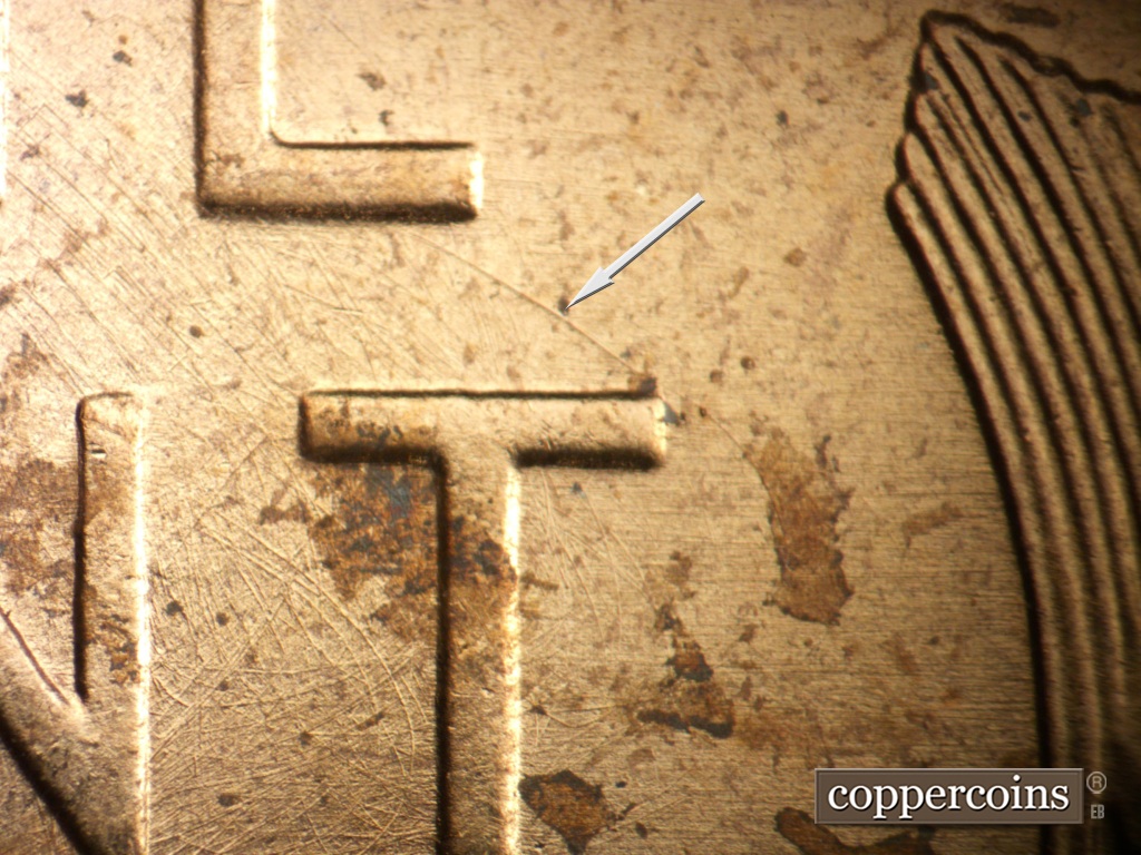 Die-stage B marker on 1957P•1DO•007 showing SE die scratch connects E in ONE to top of T in CENT. Multidirectional die scratches through T in CENT.