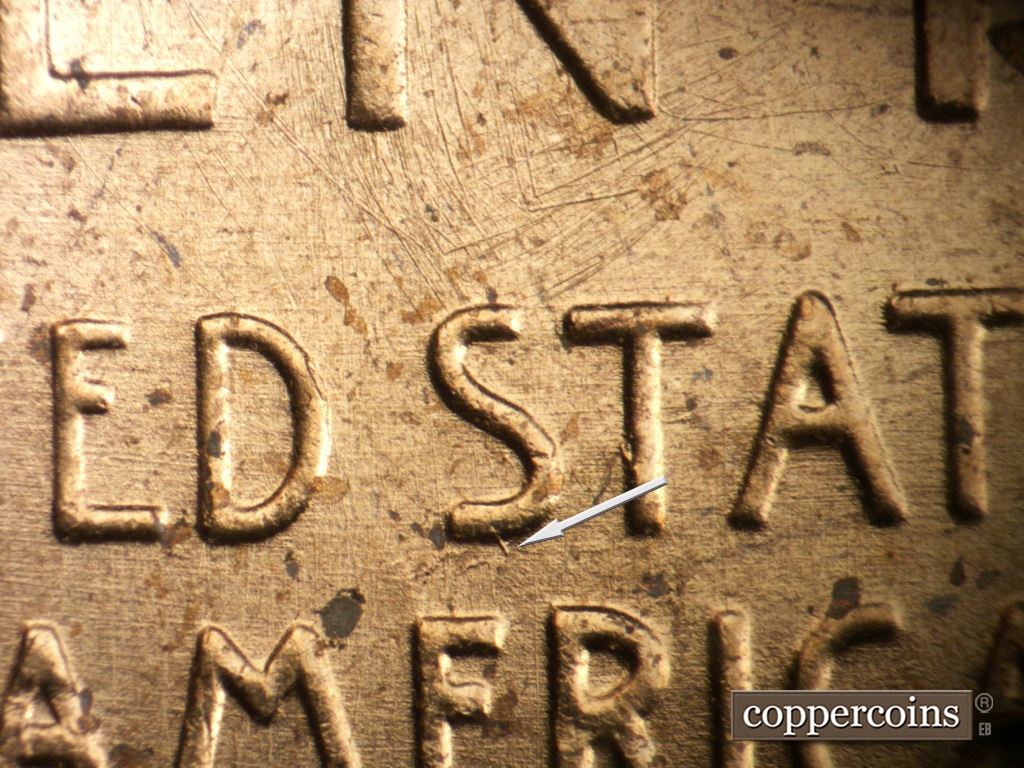Die-stage B marker on 1957P•1DO•007 showing Die gouge near bottom of first S in STATES.