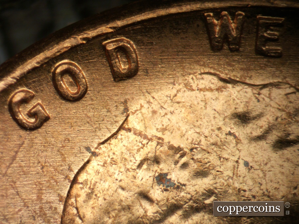 Die-stage A marker on 1957P•1DO•007 showing E/W die scratches cover top of obverse.