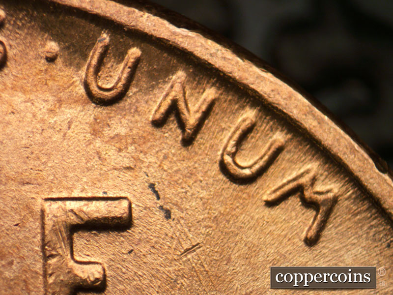 Die-stage B marker on 1957P•1DR•002 (1957 Doubled Die Reverse).