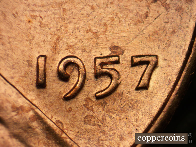 Die-stage B marker on 1957P•1DR•002 (1957 Doubled Die Reverse).
