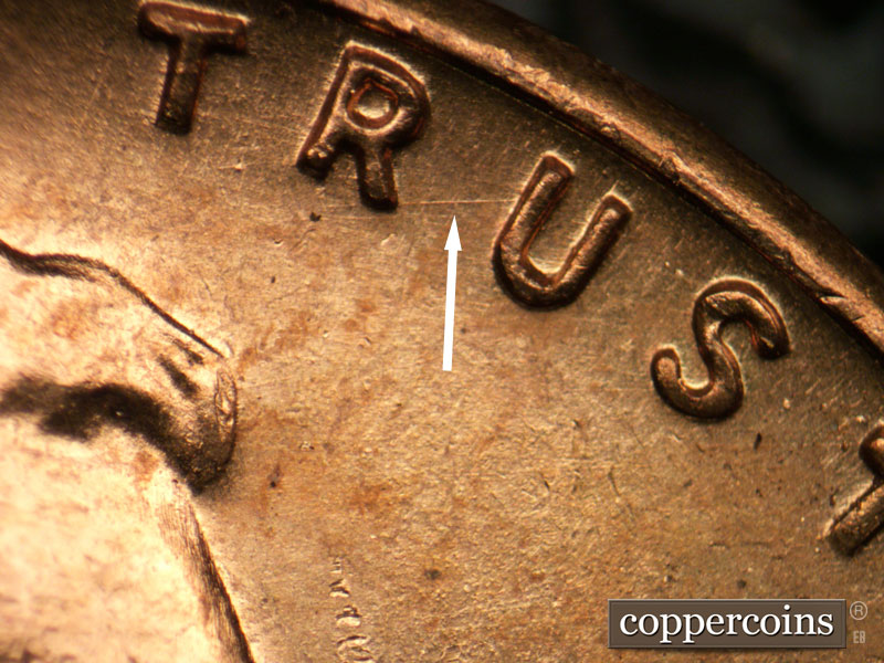 Die-stage B marker on 1957P•1DR•002 (1957 Doubled Die Reverse).