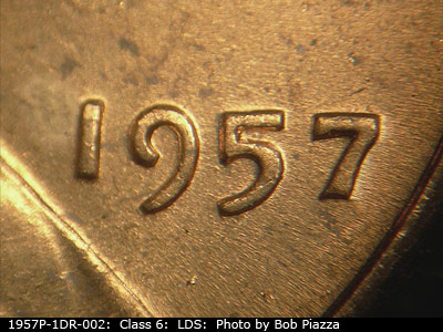 Die-stage C marker on 1957P•1DR•002 (1957 Doubled Die Reverse).