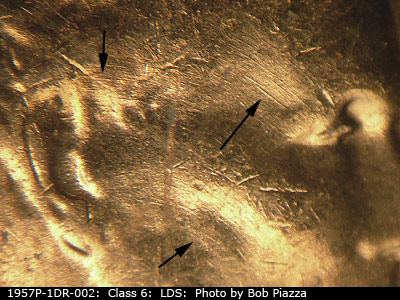 Die-stage C marker on 1957P•1DR•002 (1957 Doubled Die Reverse).