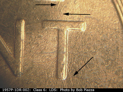 Die-stage C marker on 1957P•1DR•002 (1957 Doubled Die Reverse).