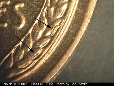 Die-stage C marker on 1957P•1DR•002 (1957 Doubled Die Reverse).