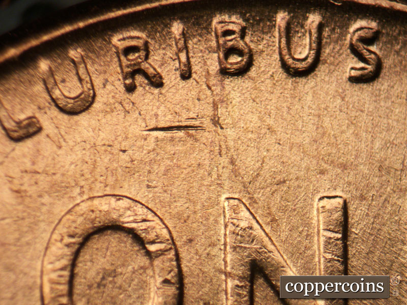 Die-stage B marker on 1957P•1DR•003 (1957 Doubled Die Reverse).