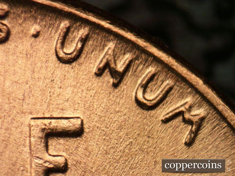 Die-stage B marker on 1957P•1DR•003 (1957 Doubled Die Reverse).