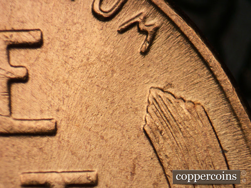 Die-stage B marker on 1957P•1DR•003 (1957 Doubled Die Reverse).