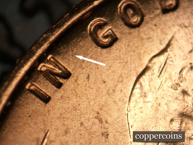Die-stage B marker on 1957P•1DR•003 (1957 Doubled Die Reverse).