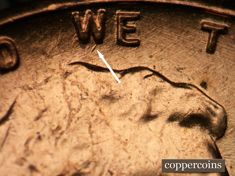 Die-stage B marker on 1957P•1DR•003 (1957 Doubled Die Reverse).
