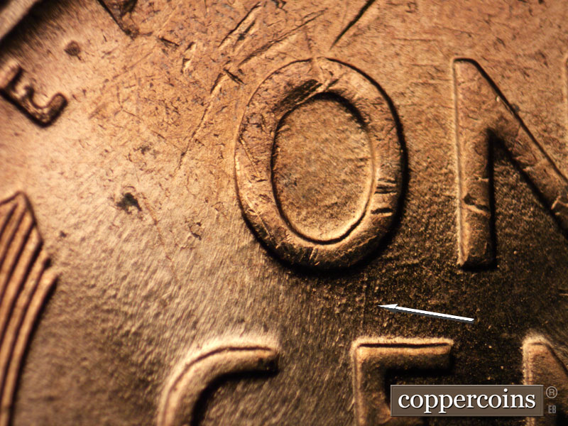 Die-stage B marker on 1958D•1DO•008 (1958 Doubled Die Obverse).