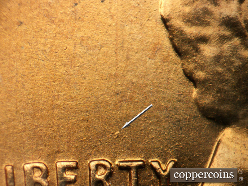 Die-stage B marker on 1958D•1DO•010 (1958 Doubled Die Obverse).
