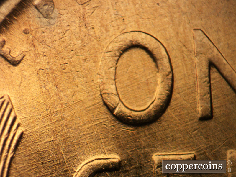 Die-stage B marker on 1958D•1DO•010 (1958 Doubled Die Obverse).