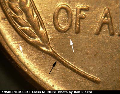 Die-stage B marker on 1958D•1DR•001 (1958 Doubled Die Reverse).