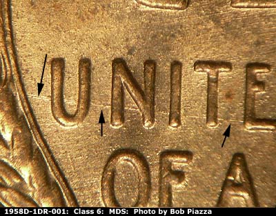 Die-stage B marker on 1958D•1DR•001 (1958 Doubled Die Reverse).