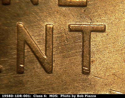 Die-stage B marker on 1958D•1DR•001 (1958 Doubled Die Reverse).