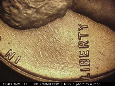 Die-stage B marker on 1958D•1MM•013 (1958 Repunched Mint Mark).