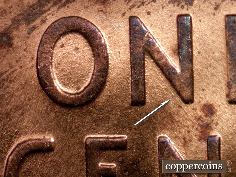 Die-stage B marker on 1958D•1MM•014 (1958 Repunched Mint Mark).