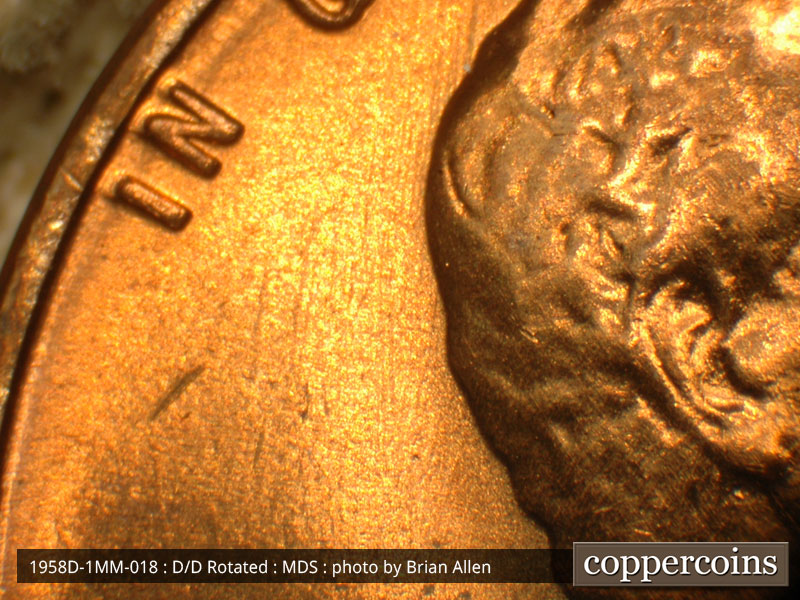 Die-stage B marker on 1958D•1MM•018 (1958 Repunched Mint Mark).