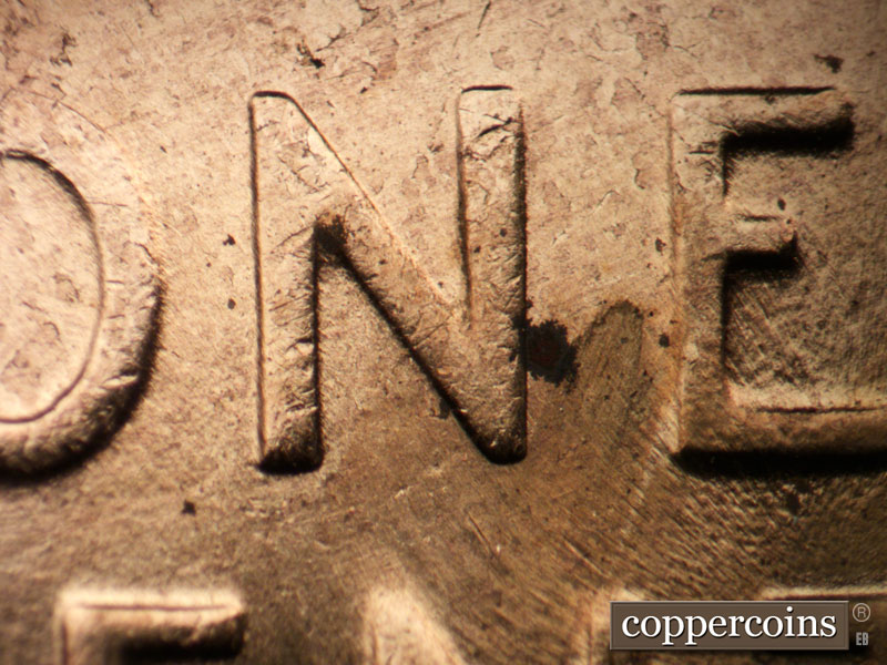 Die-stage B marker on 1958D•1MM•047 (1958 Repunched Mint Mark).