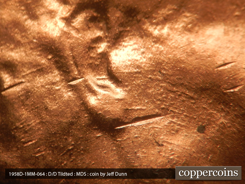 Die-stage B marker on 1958D•1MM•064 (1958 Repunched Mint Mark).