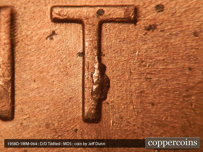 Die-stage B marker on 1958D•1MM•064 (1958 Repunched Mint Mark).
