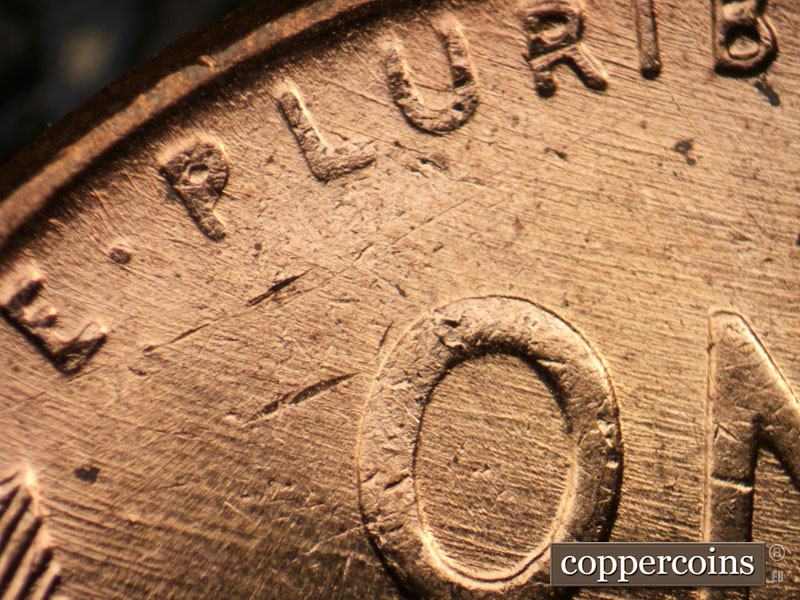 Die-stage B marker on 1958D•1MM•099 (1958 Repunched Mint Mark).