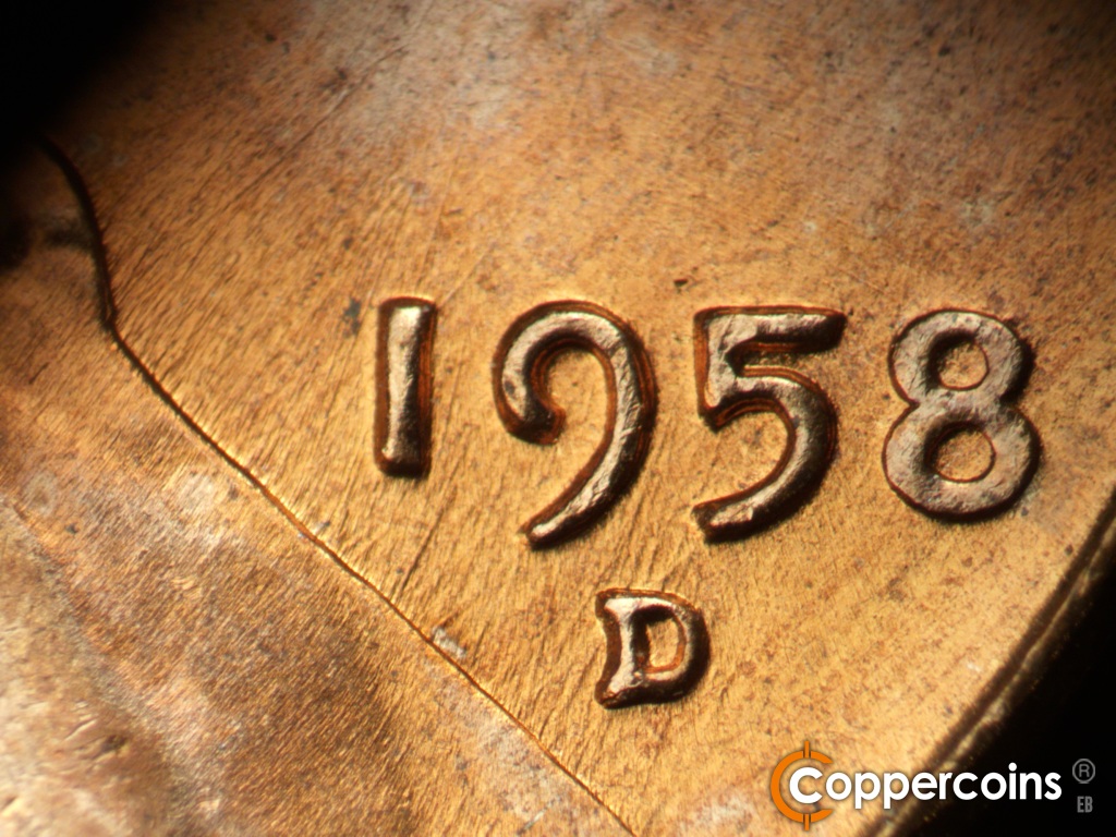 Die-stage B marker on 1958D•1MM•112 showing Die scratches throughout ate area.