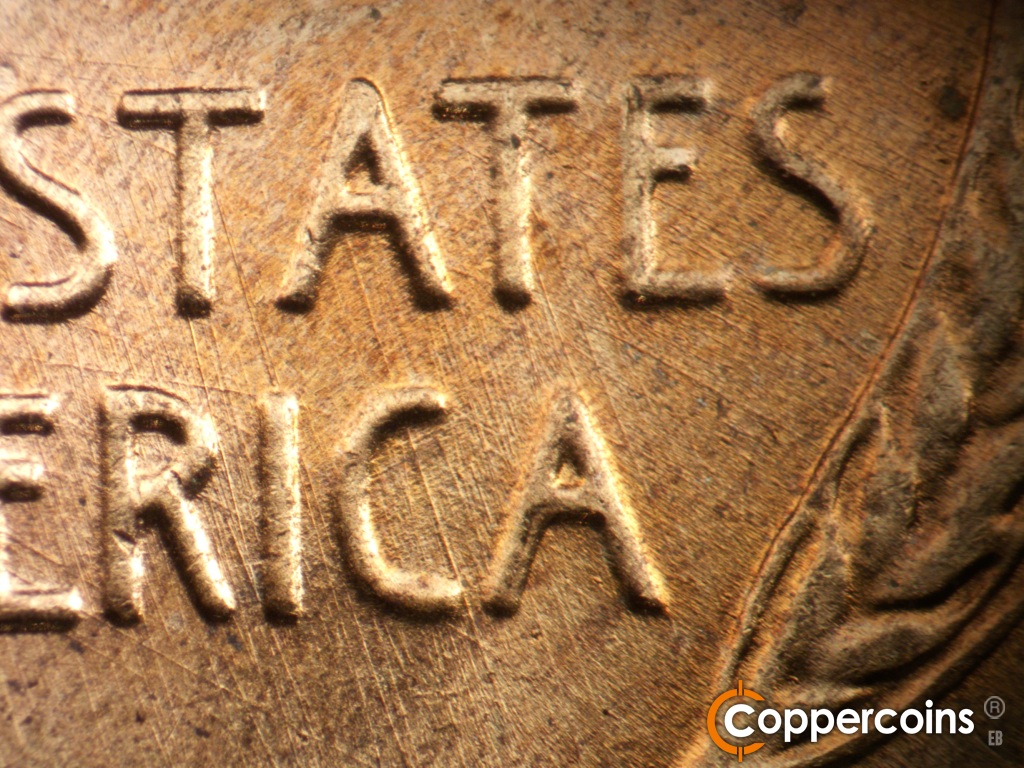 Die-stage B marker on 1958D•1MM•112 showing SE die scratches from A in STATES to RICA in AMERICA.