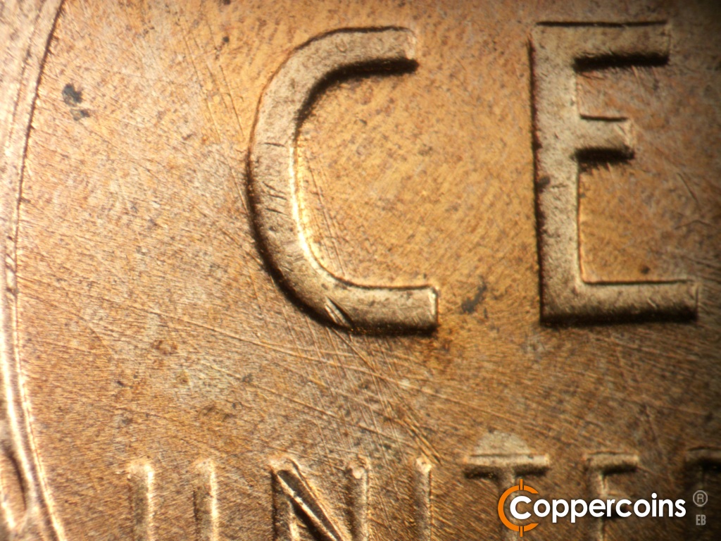 Die-stage B marker on 1958D•1MM•112 showing Die scratches between C in CENT and UNITED.