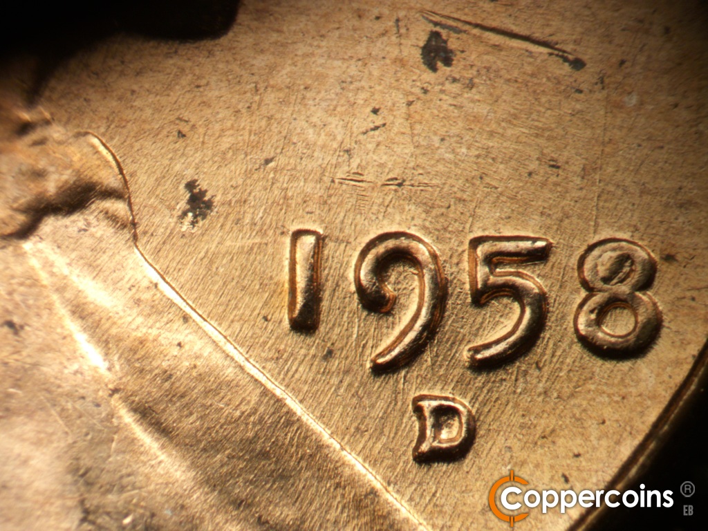 Die-stage C marker on 1958D•1MM•112 showing Die scratches through date.