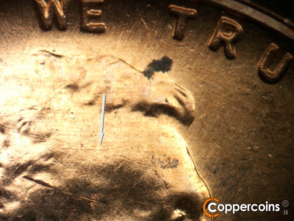 Die-stage C marker on 1958D•1MM•112 showing Die crack across forehead.