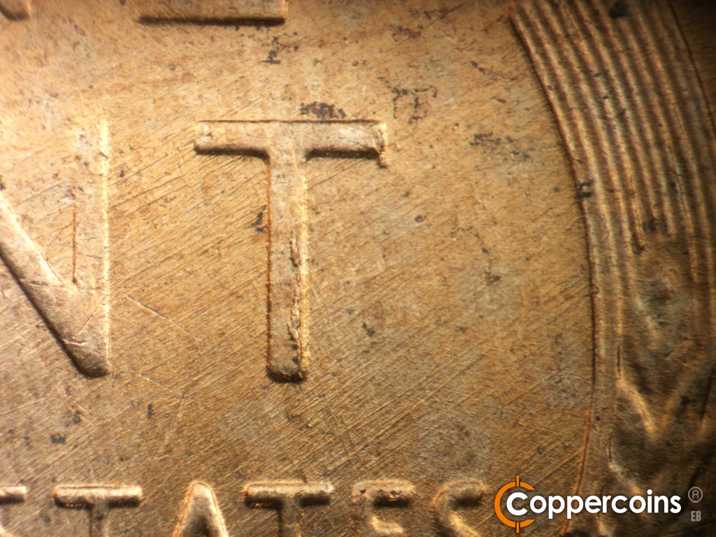 Die-stage C marker on 1958D•1MM•112 showing NE die scratches through T in CENT. Die chips on vertical of T in CENT.