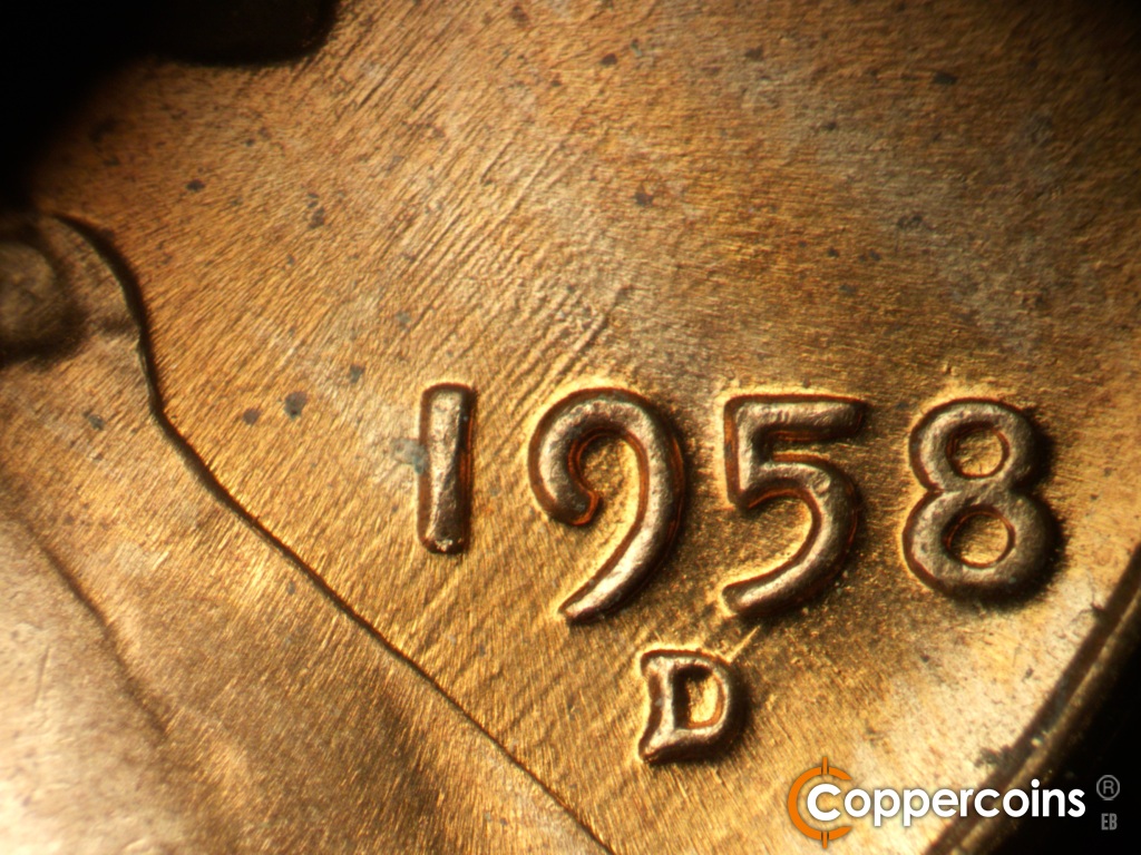 Die-stage B marker on 1958D•1MM•116 showing NE die scrathes from lapel into date.