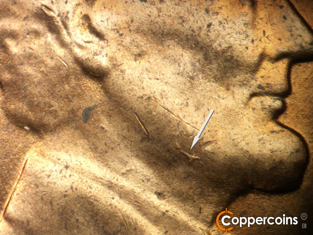 Die-stage B marker on 1958D•1MM•116 showing Die gouge on jaw.