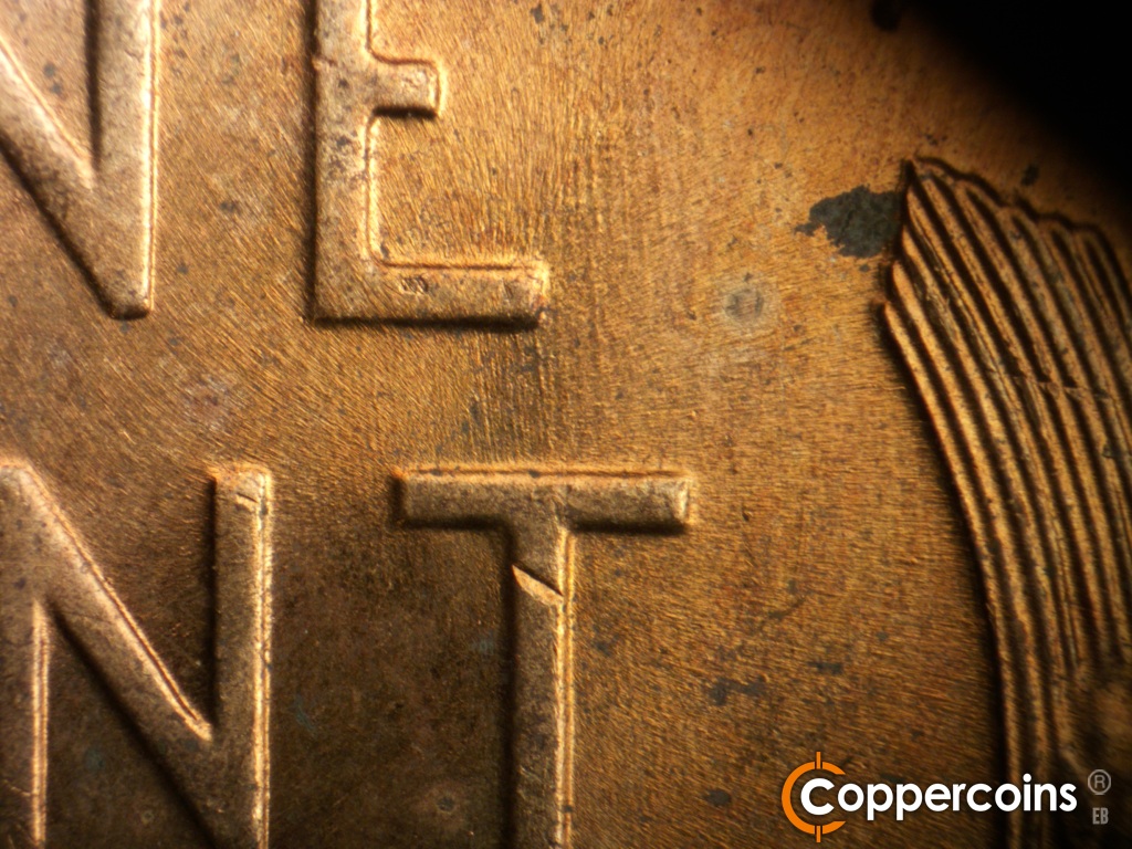 Die-stage B marker on 1958D•1MM•116 showing N/S die scratches from T in CENT.