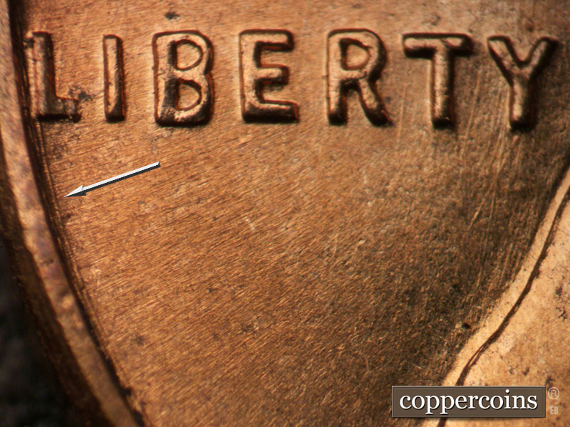 Die-stage A marker on 1959D•1DO•002 (1959 Doubled Die Obverse).