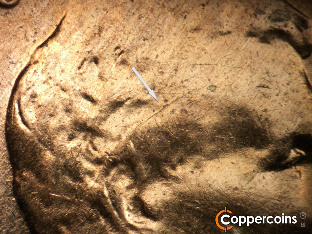 Die-stage B marker on 1959D•1MM•127 showing Die crack from hair into forehead.