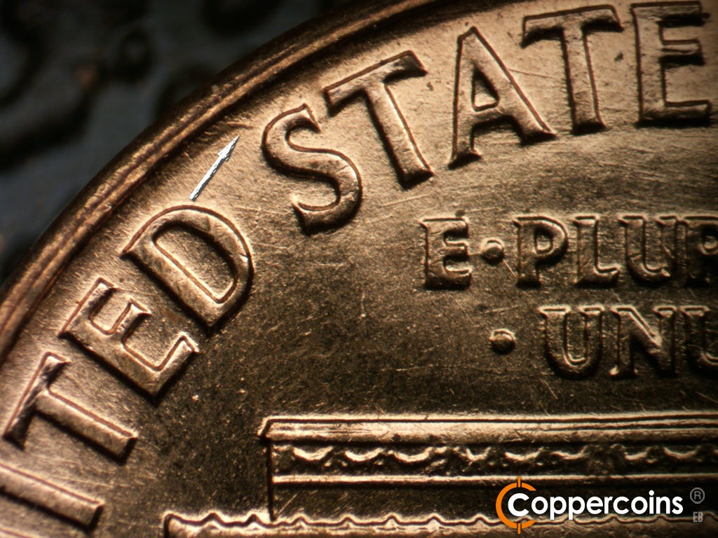Die-stage B marker on 1959D•1MM•129 showing Die gouge near rim between D in UNITED and first S in STATES.