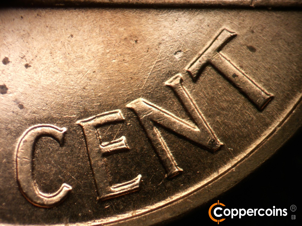 Die-stage B marker on 1959D•1MM•129 showing NE/SW die scratch from top of N in CENT.