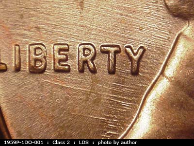 Die-stage C marker on 1959P•1DO•001 (1959 Doubled Die Obverse).