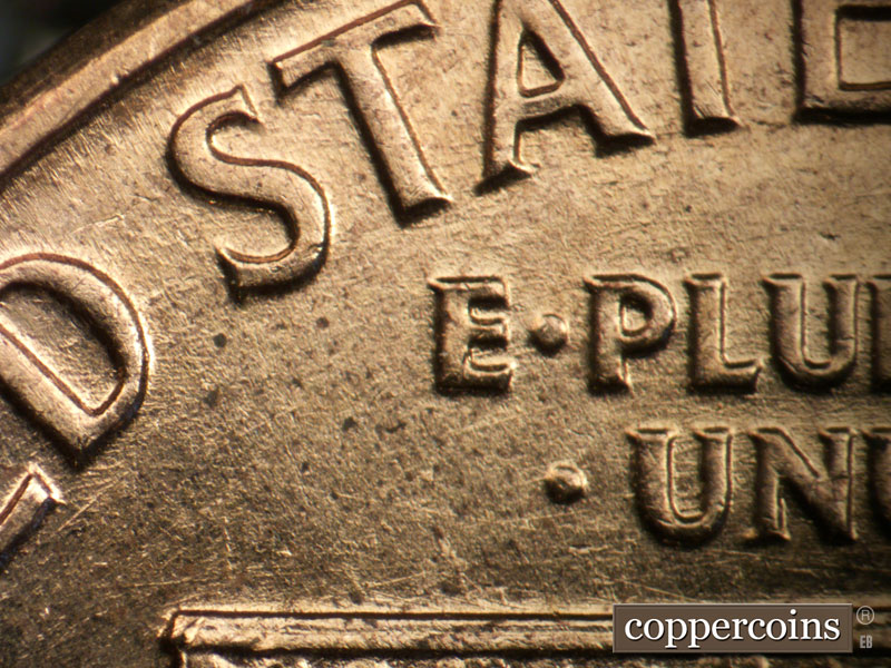 Die-stage B marker on 1960D•1DO•001 showing E/W die scratches through E PLURIBUS UNUM.