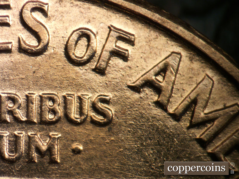 Die-stage B marker on 1960D•1DO•001 showing E/W die scratches through E PLURIBUS UNUM.