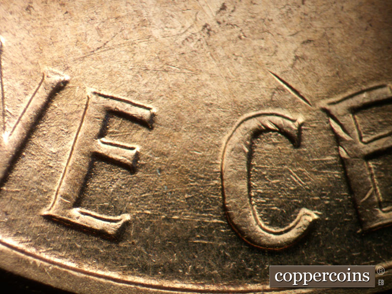 Die-stage B marker on 1960D•1DO•001 showing Die scratches through ONE CENT.