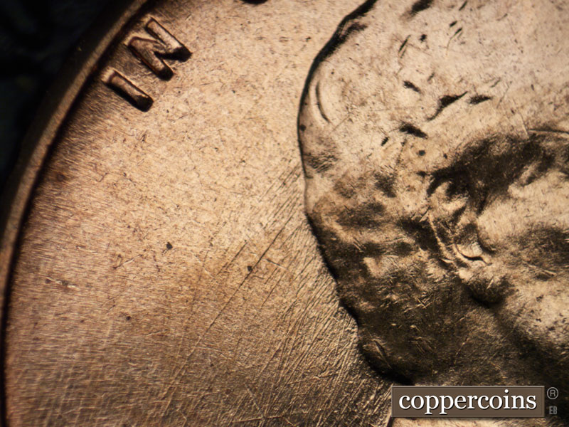 Die-stage B marker on 1960D•1DO•003 showing SW die scratches from hair.