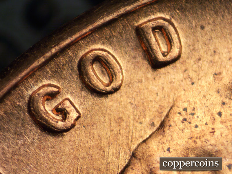 Die-stage B marker on 1960D•1DO•004 showing Doubling on GOD. NNE die scratches from top of head.