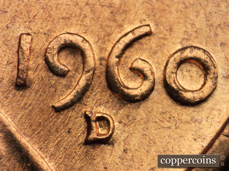 Die-stage B marker on 1960D•1DO•004 showing Heavy die scratches run NE-SW through the date.