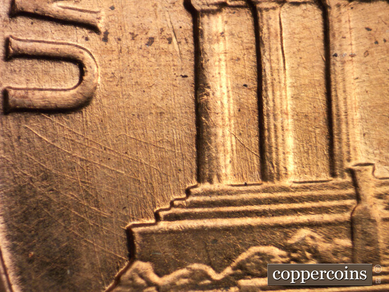 Die-stage B marker on 1960D•1DO•004 showing Multidirectional die scratches west of column 1 under UNITED.