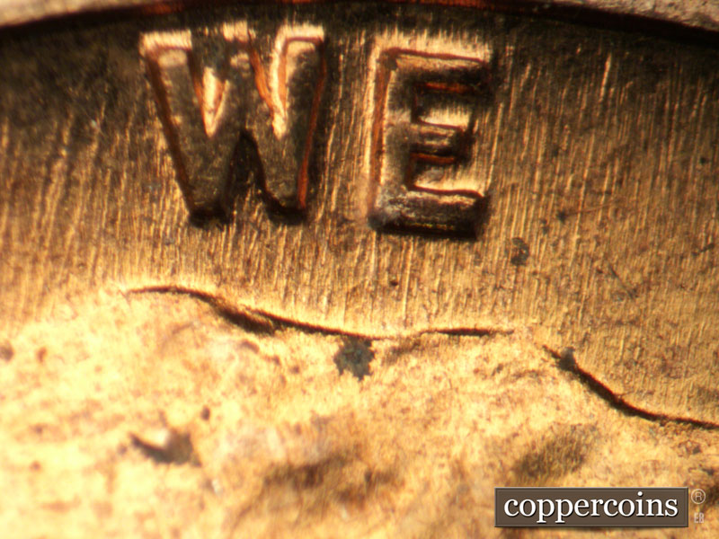 Die-stage B marker on 1960D•1DO•005 showing NNE die scratches through WE.